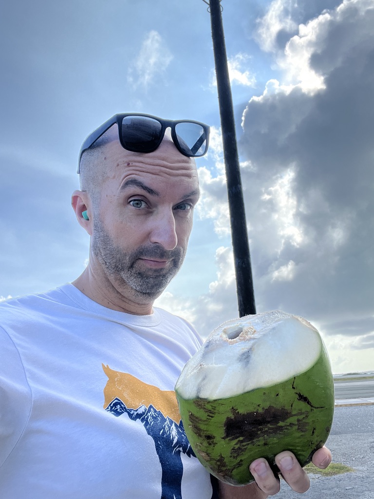 Enjoying some delicious and fresh coconut water.